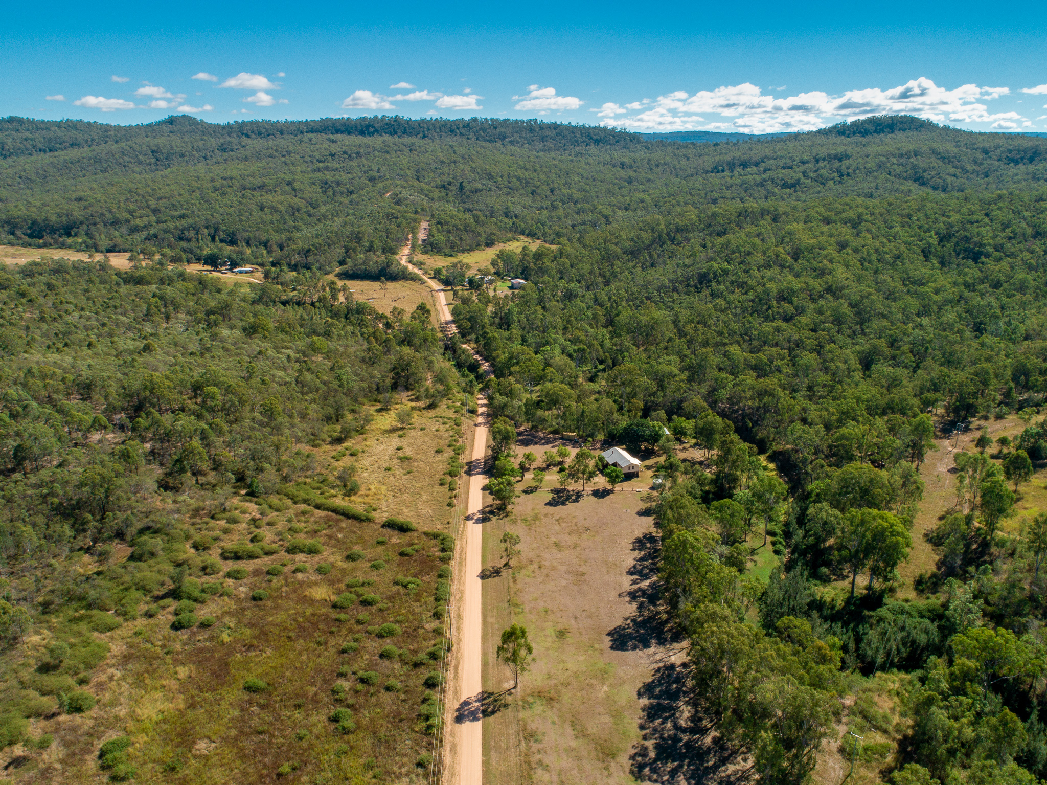 Aerial view of the freight train moving along the farmland, North Star, NSW.;