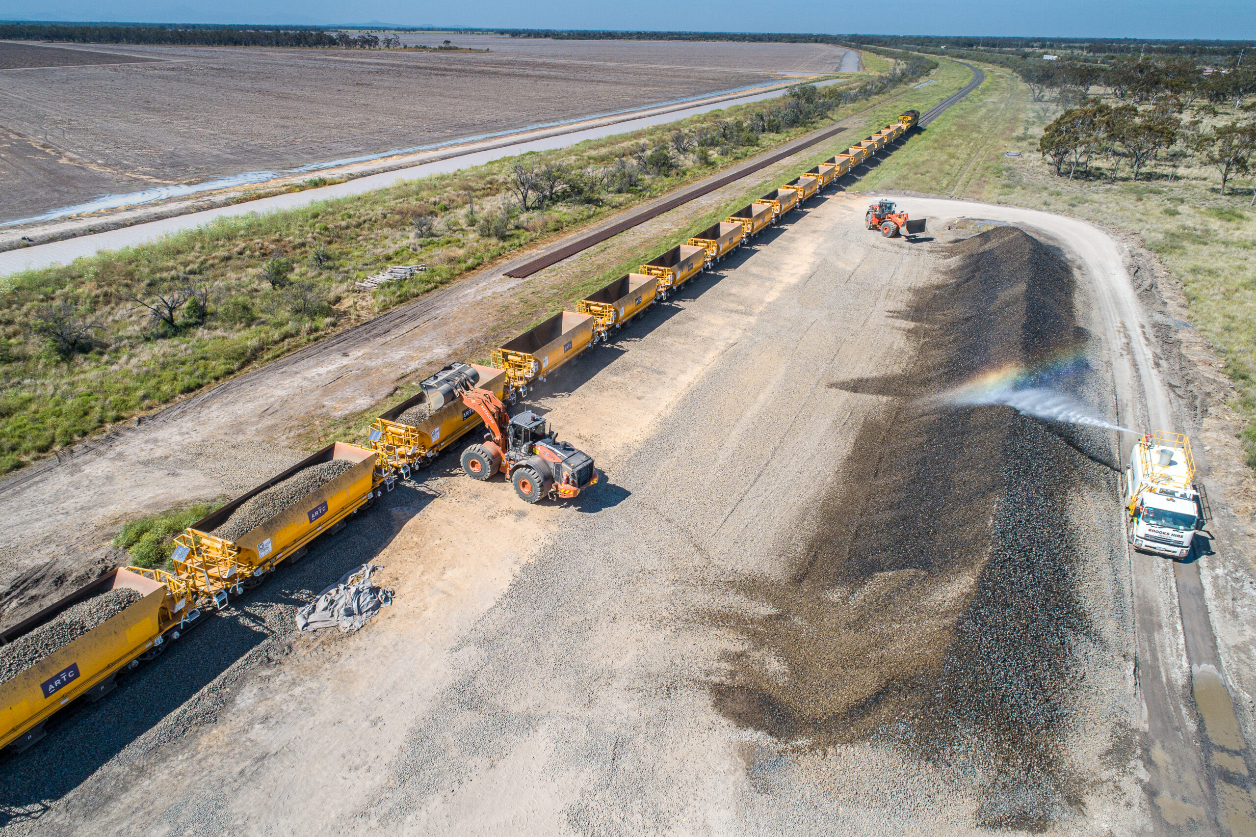 Front end loader loading Ballast Train between Tapscott Road and Gurley;